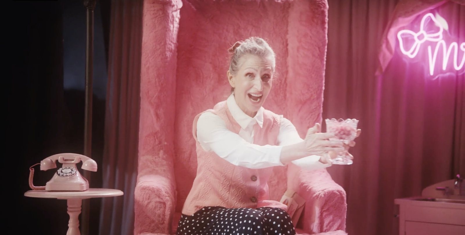 Mrs. Ladadee offering a bowl of pink candy